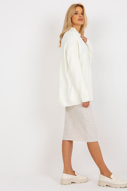 Model wearing the Luxurious Rue Paris Loose Cut Sweater with Heart Neckline and Long Sleeves, epitomizing comfort and elegance for everyday wear.