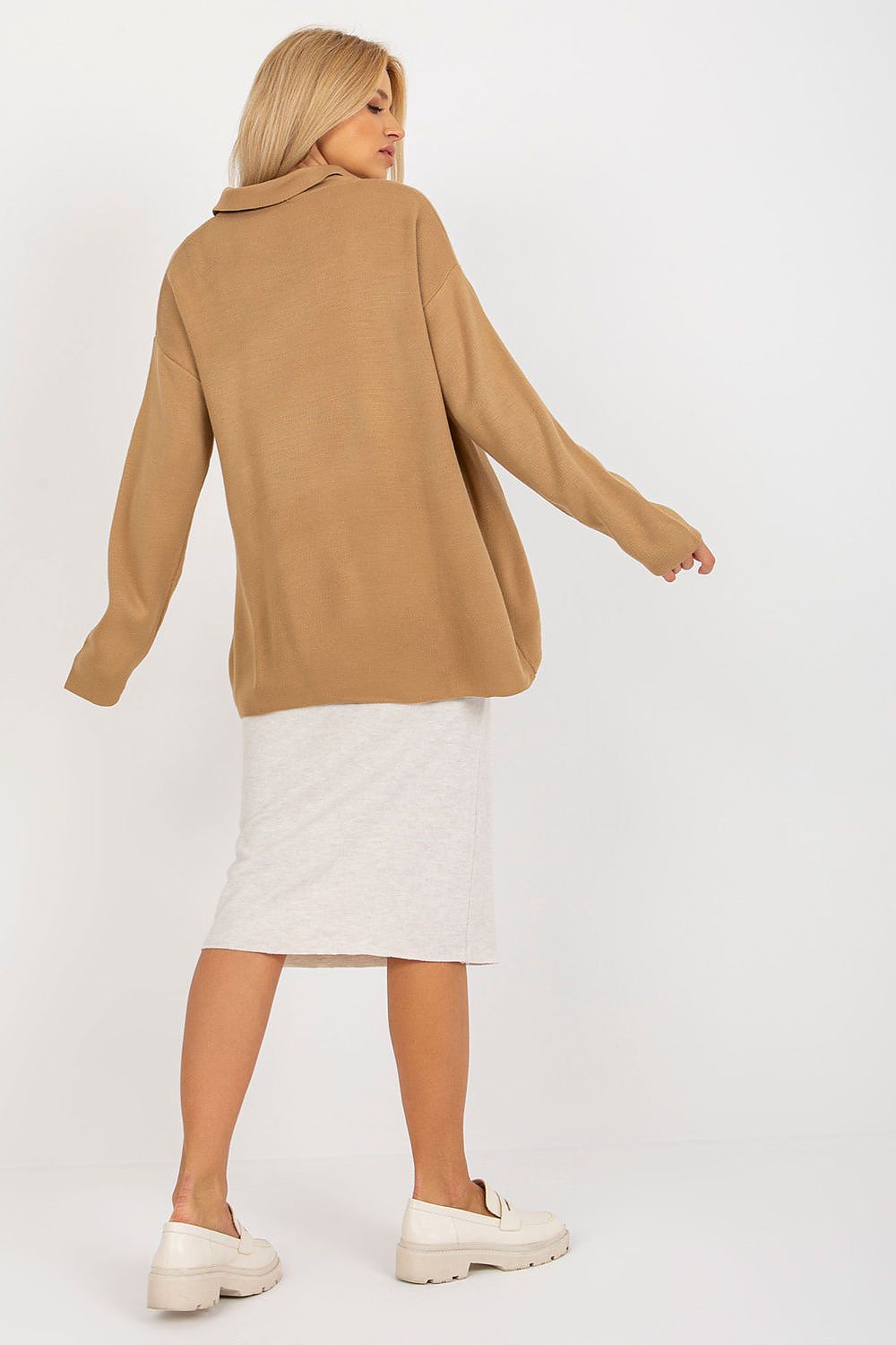 Stylish close-up view of the Luxurious Rue Paris Loose Cut Sweater featuring a heart neckline and long sleeves.