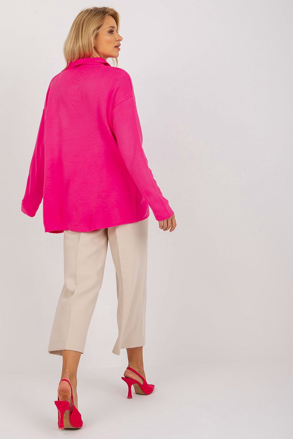 Luxurious Rue Paris Loose Cut Sweater displayed on a hanger, highlighting its exquisite heart neckline and soft fabric.