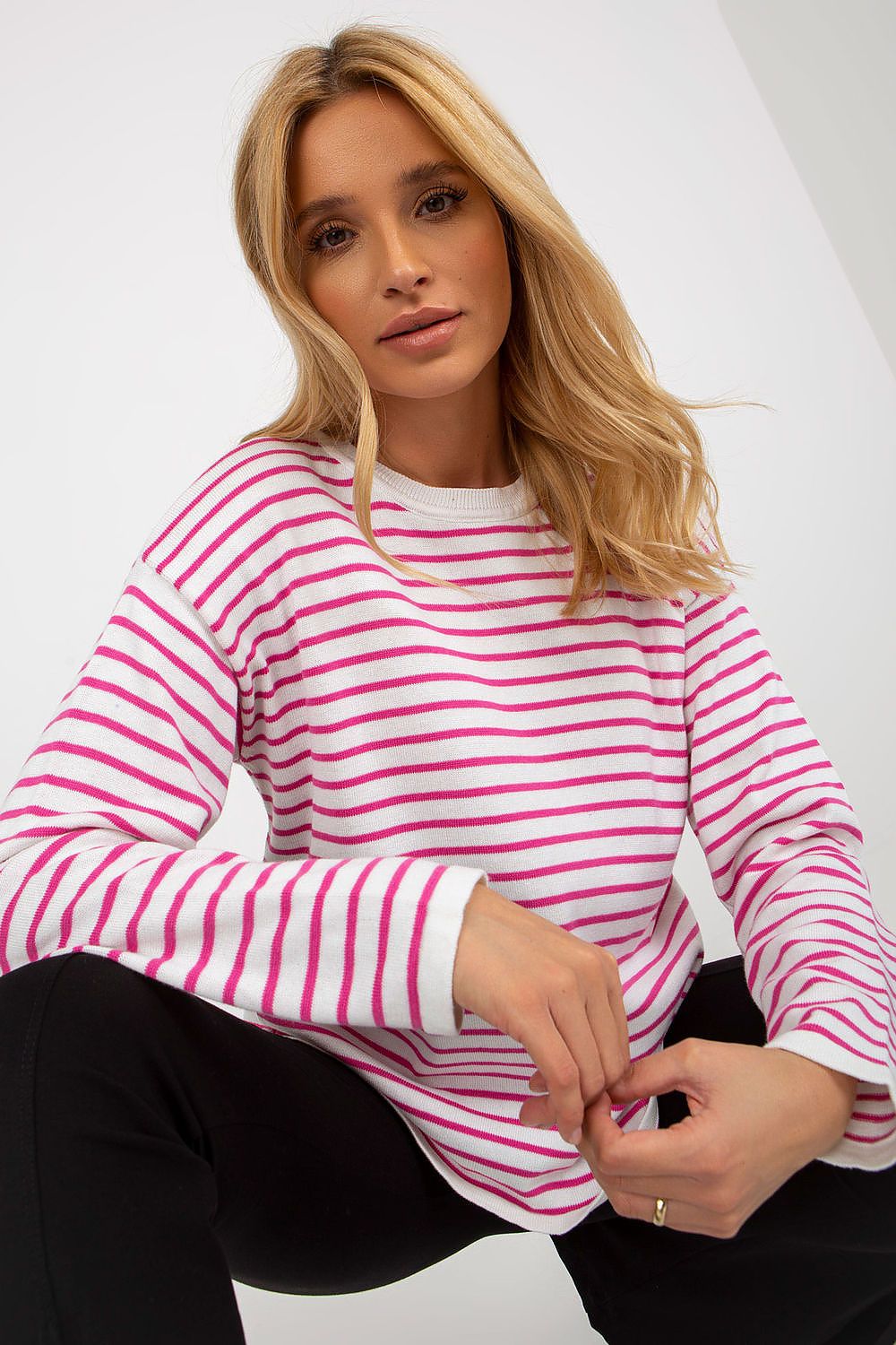 Luxurious Striped Women's Sweater by Rue Paris with vibrant stripes and classic cut, showcasing round neckline and long sleeves.