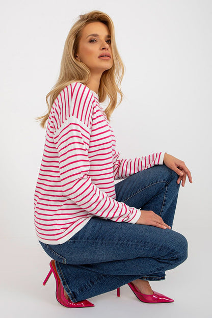Stylish model wearing Luxurious Striped Women's Sweater by Rue Paris, highlighting the round neckline and chic design.
