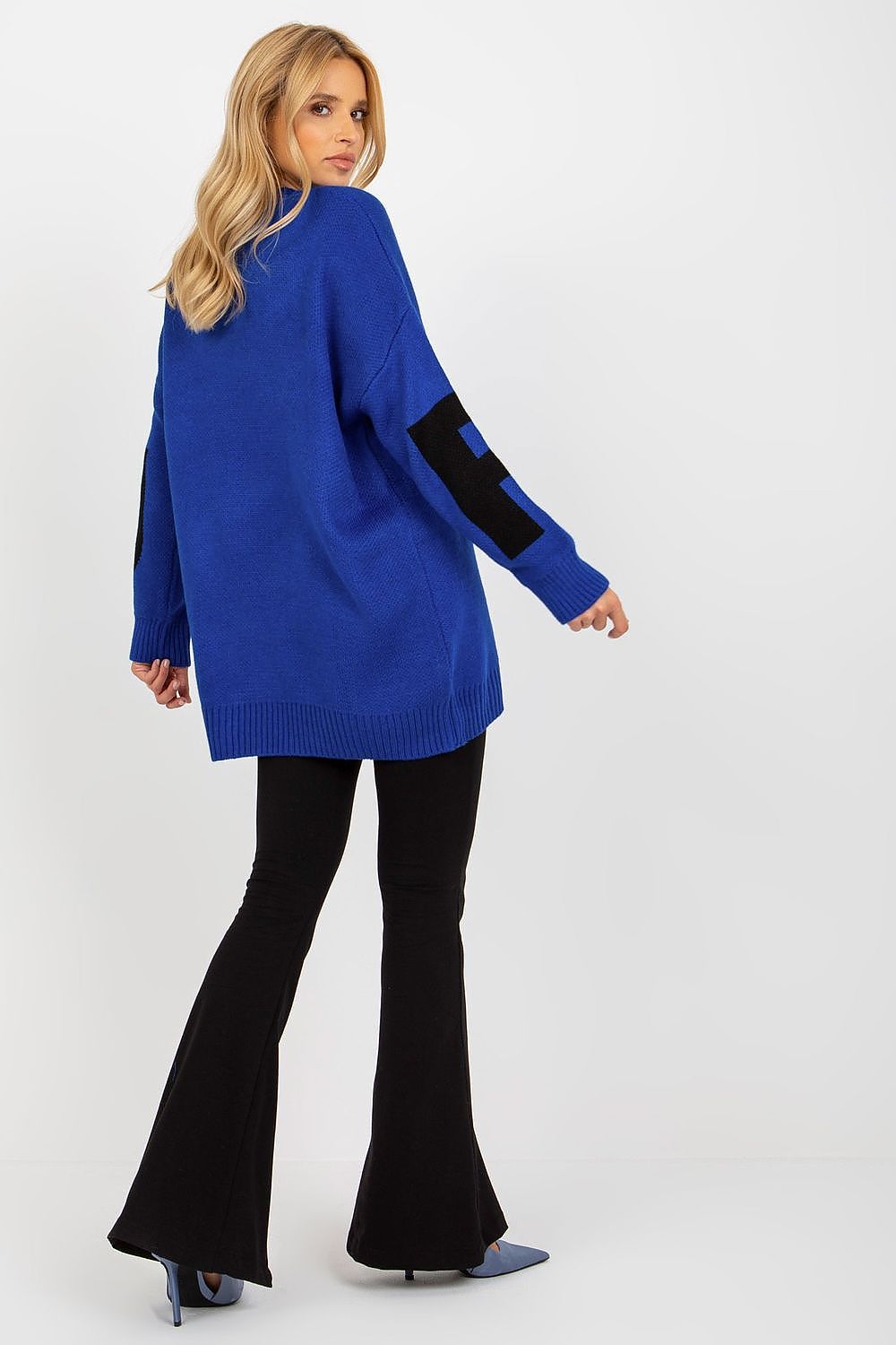 Model wearing the Elegant Long Sleeve Jumper by Rue Paris, displaying its extended cut and stylish design, perfect for elevating your wardrobe.