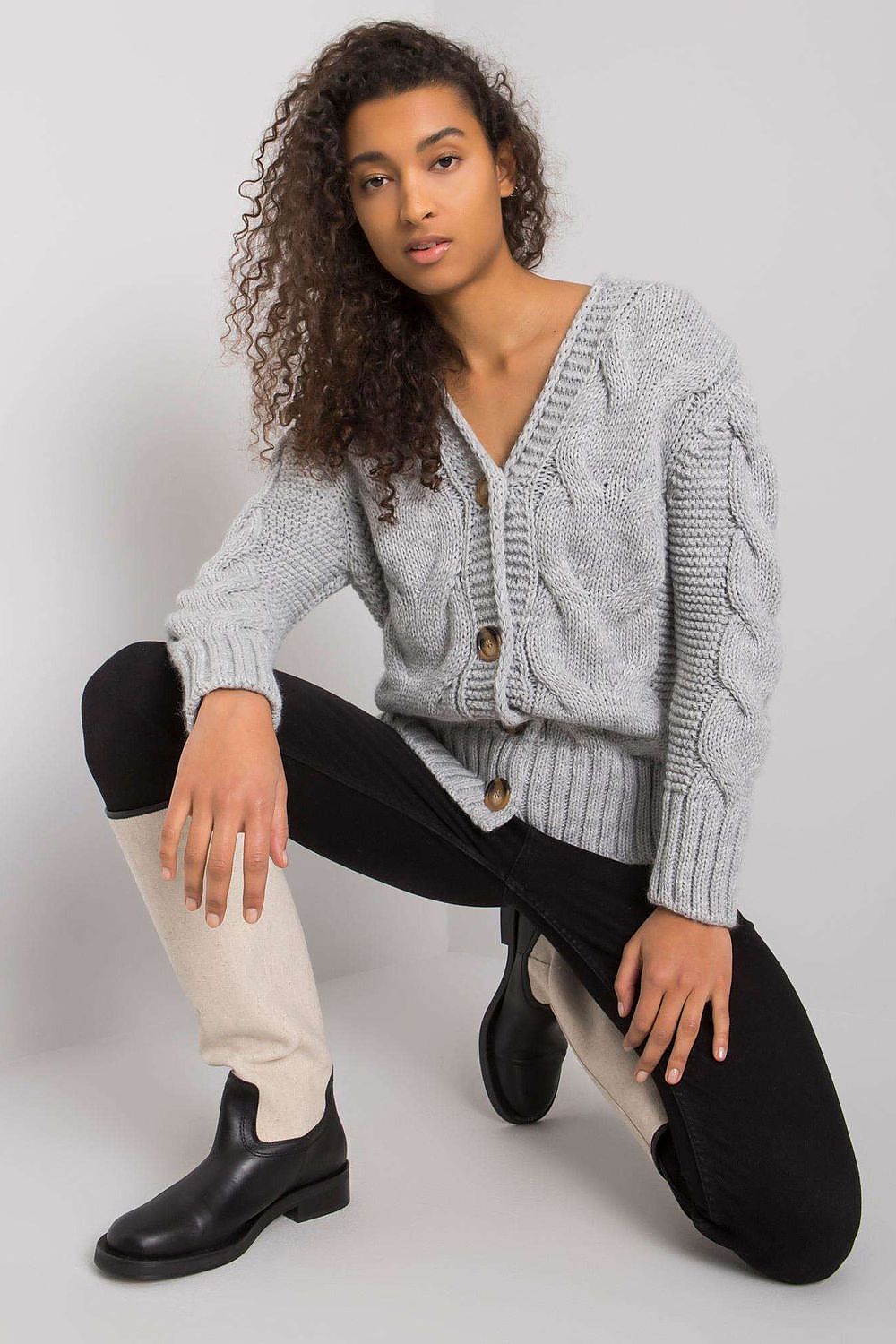 Luxurious Women's Cardigan by Rue Paris in a beautiful setting, highlighting its soft acrylic and wool fabric.