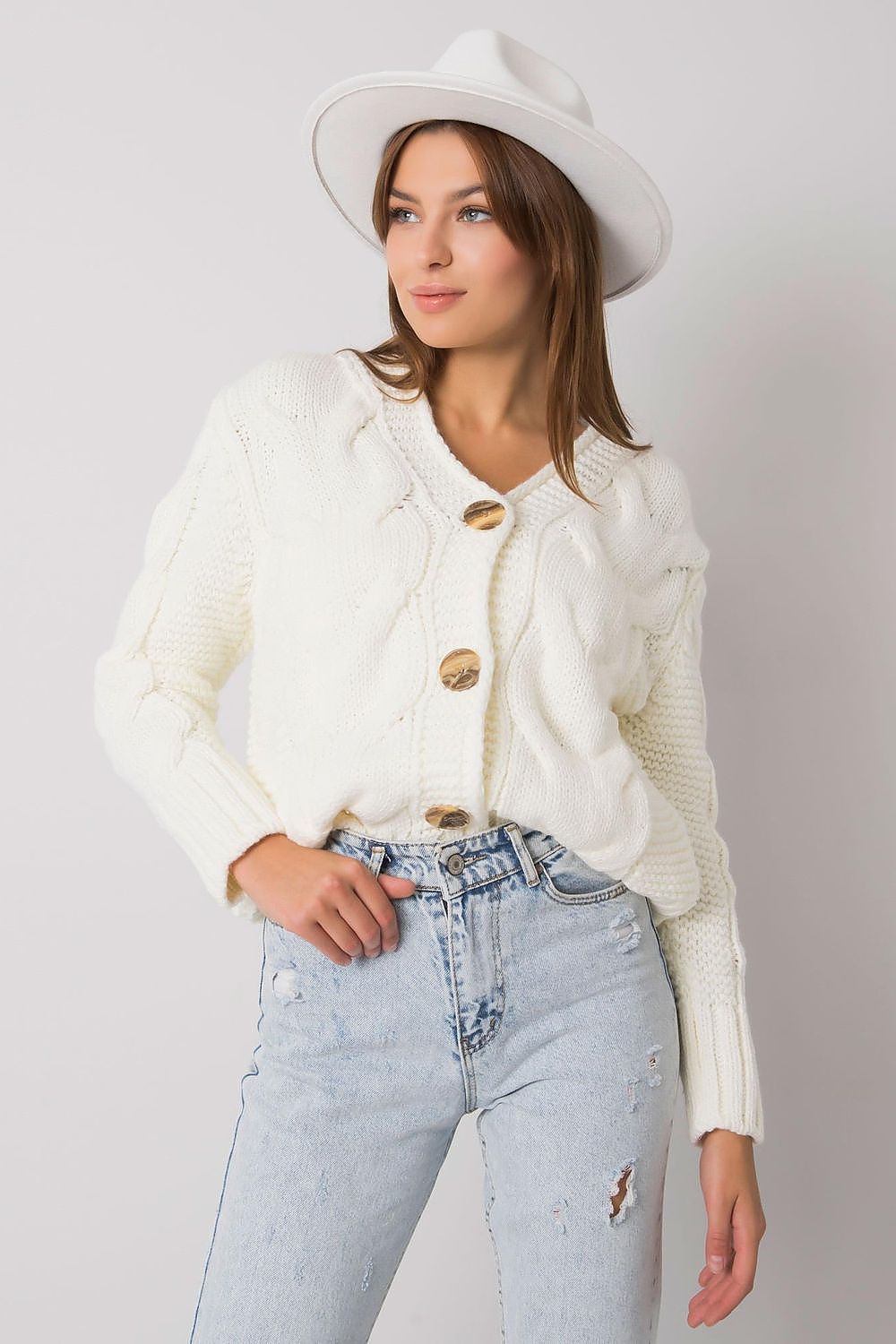The Luxurious Women's Cardigan by Rue Paris - a fashionable button-down sweater with a unique heart neckline in a chic pose.