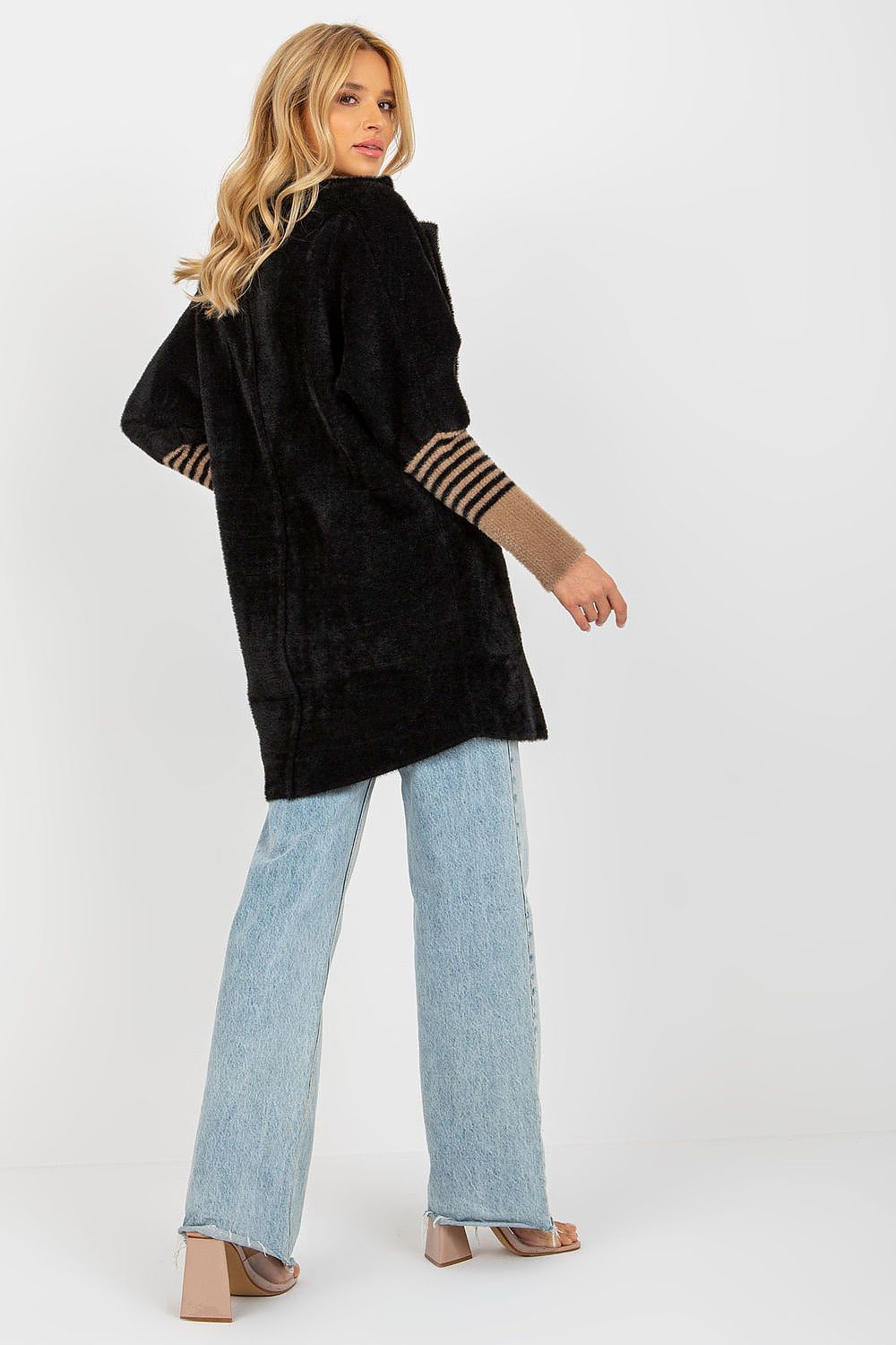 Luxurious Women's Long Sleeve Wool Blend Coat with Large Pockets and Press Stud Fastening displayed on a hanger, featuring its detailed pocket and fastening detail.