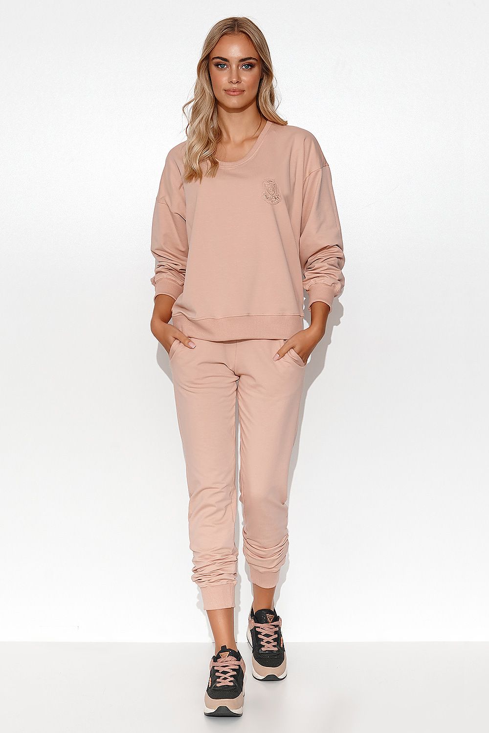 Luxury Women's Lightweight Knit Sweatshirt and Pants Set featuring stylish ribbed cuffs and a neckline that subtly reveals the collarbones.