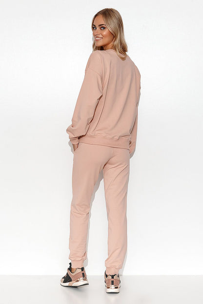 Close-up of Luxury Women's Lightweight Knit Sweatshirt and Pants Set by Makadamia, showcasing the elegant ribbed details and soft fabric texture.