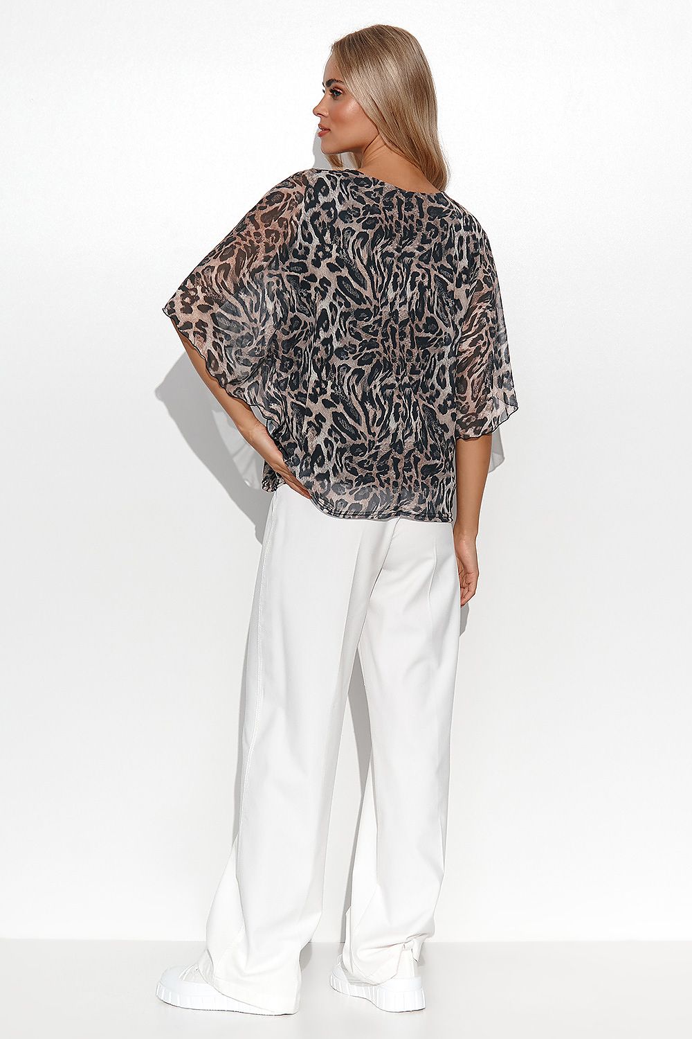 Sleek Makadamia Women's Airy Blouse featuring kimono sleeves and a solid base, perfect for pairing with trousers or skirts for a sophisticated look.