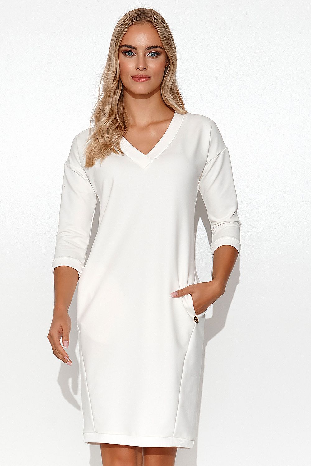 Stylish Makadamia Tracksuit Dress with V-Neck, 3/4 Sleeves and Pockets showcased elegantly in a luxurious setting, perfect summer attire for casual and stylish outings.
