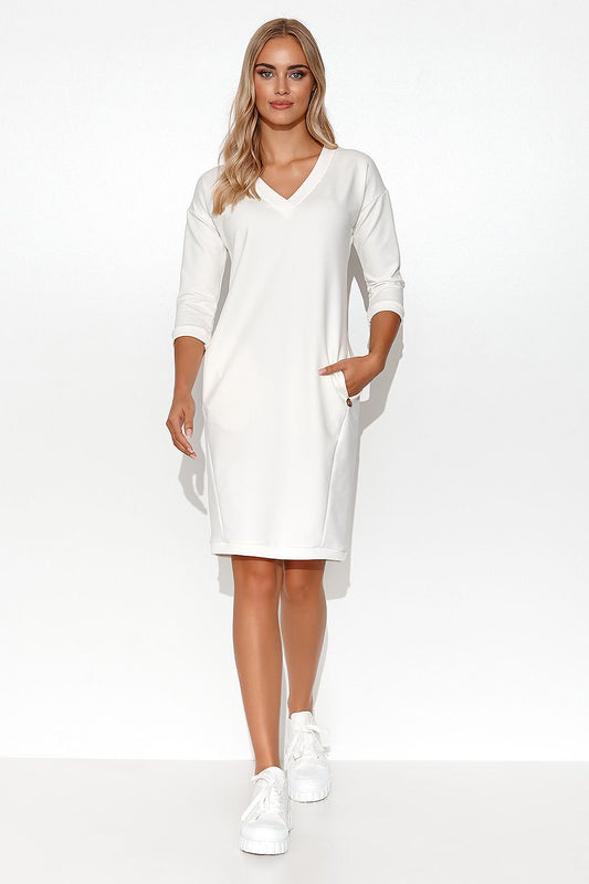 Close-up view of the Stylish Makadamia Tracksuit Dress detailing the deep V-neck and practical side pockets, ideal for summer style and comfort.