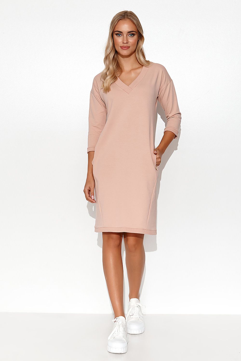 Stylish Makadamia Tracksuit Dress shown in a sunny outdoor environment, representing the essence of perfect summer attire with elegance and comfort.