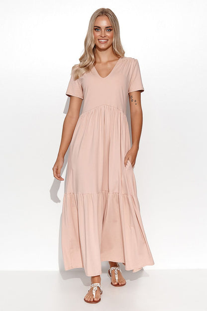 Close-up of the Elegant Makadamia Maxi Dress with Ruffles and V-Neckline, highlighting luxurious fabric and romantic details.