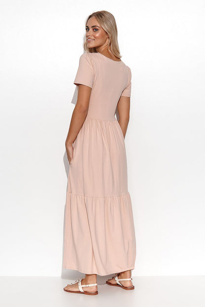 Model wearing the Elegant Makadamia Maxi Dress with Ruffles and V-Neckline, exuding grace and sophistication.
