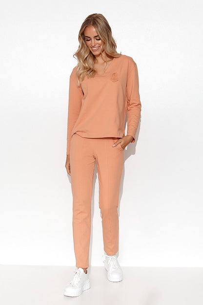 Elegant Makadamia Women's Tracksuit Set with V-Neck Blouse and Straight Leg Pants, featuring a minimalist design and chic modelling.