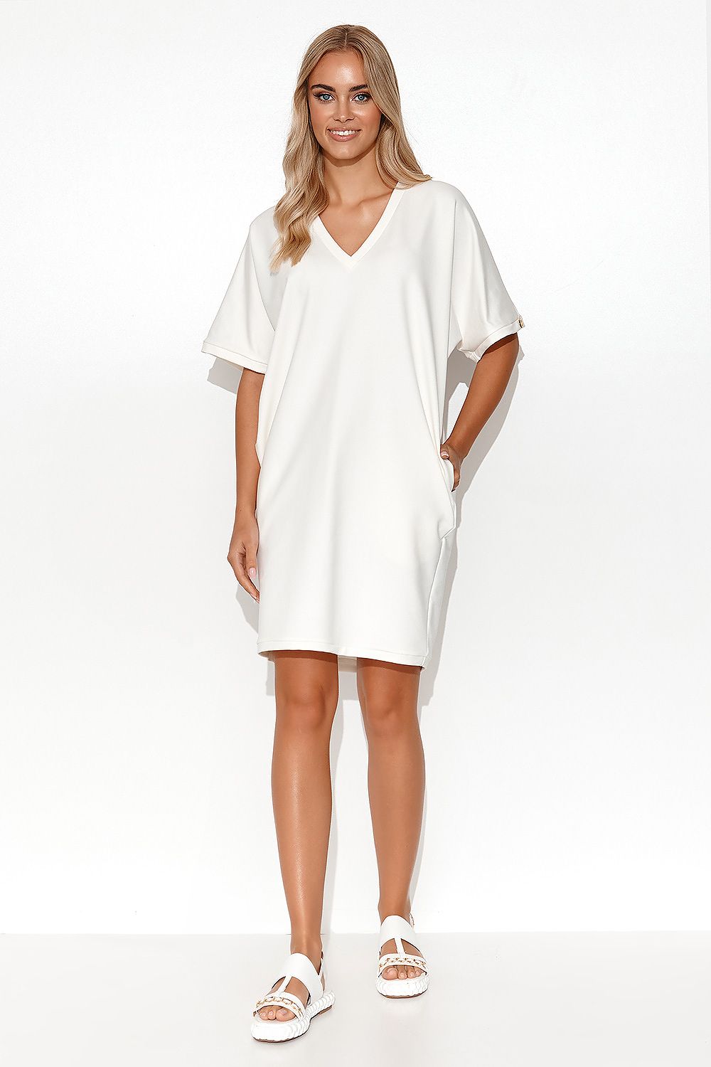 Close-up of the Luxury Makadamia Kimono Dress highlighting the intricate heart neckline and casual pockets for sophisticated everyday wear.