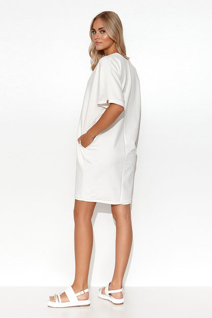 Model wearing the Luxury Makadamia Kimono Dress with Heart Neckline and Pockets, demonstrating its perfect fit and feminine silhouette.