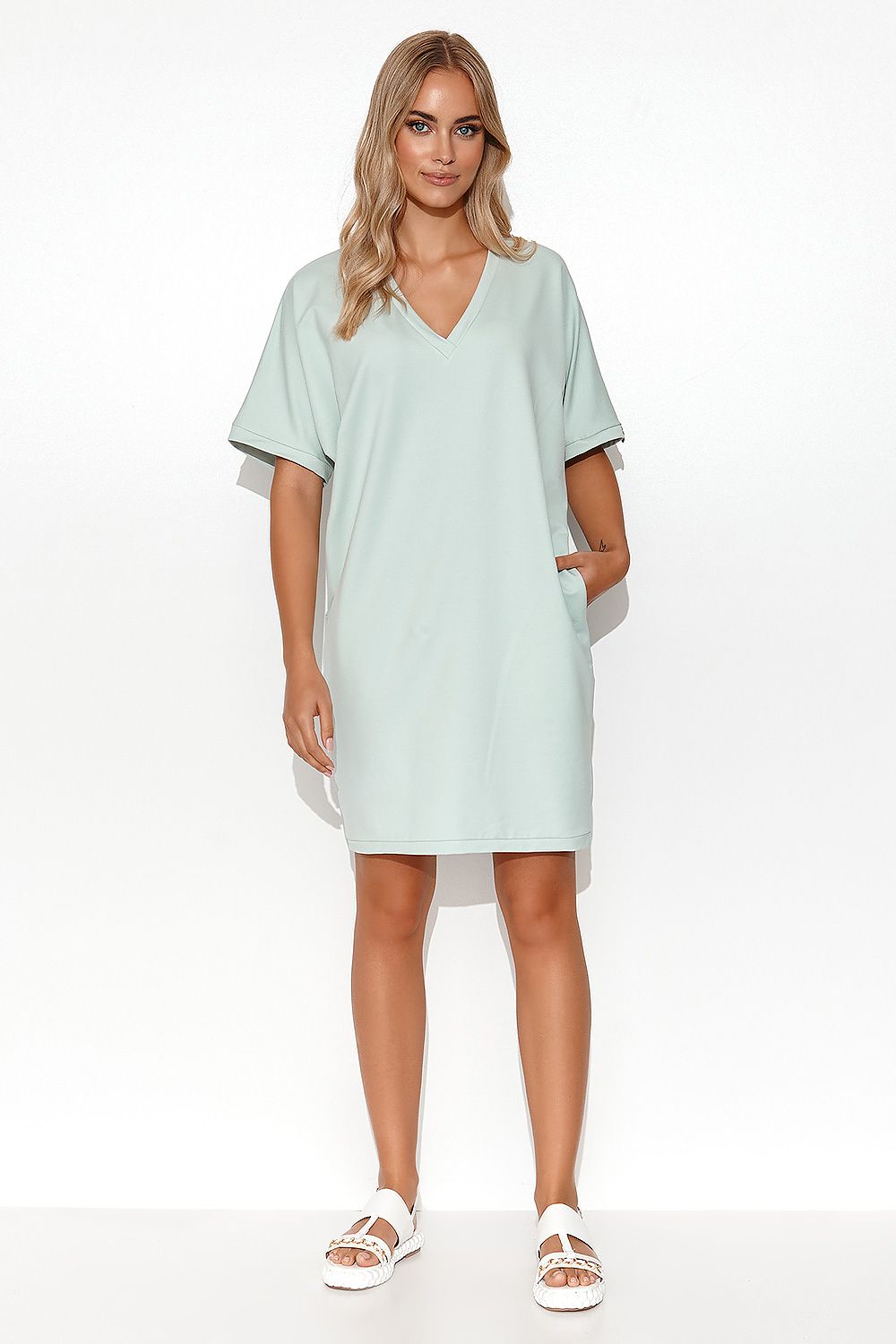 Luxury Makadamia Kimono Dress with Heart Neckline and Pockets showcased on a model, emphasising casual elegance with its cotton blend fabric.