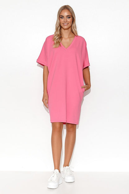 Close-up view of the Luxury Makadamia Kimono Dress featuring a heart neckline, designed for comfort and femininity with side pockets.