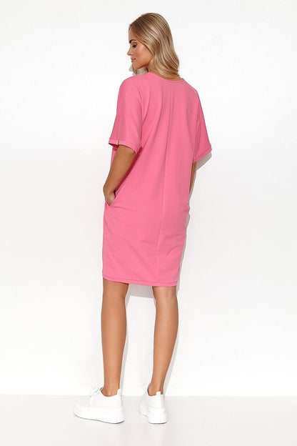 Model wearing the Luxury Makadamia Kimono Dress with Heart Neckline and Pockets, exemplifying the dress's flattering silhouette and stylish casual cotton blend.