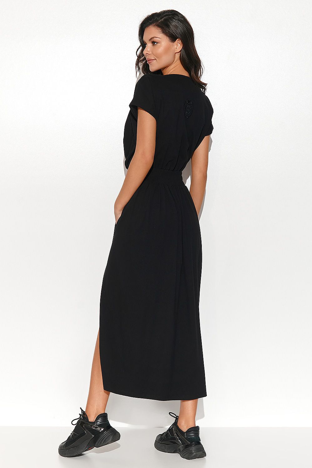 Sophisticated Numinou Long Asymmetrical Dress in a knitted fabric, designed for comfort and a luxurious casual style.