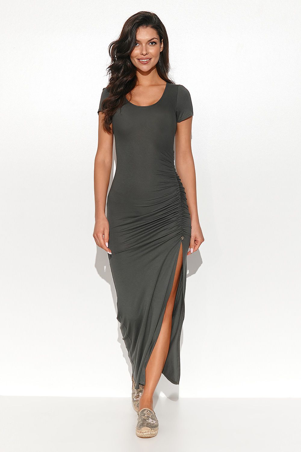 Elegant Numinou Long Fitted Dress in Stretch Viscose featuring chic side slit and gold detail, perfect for formal events.