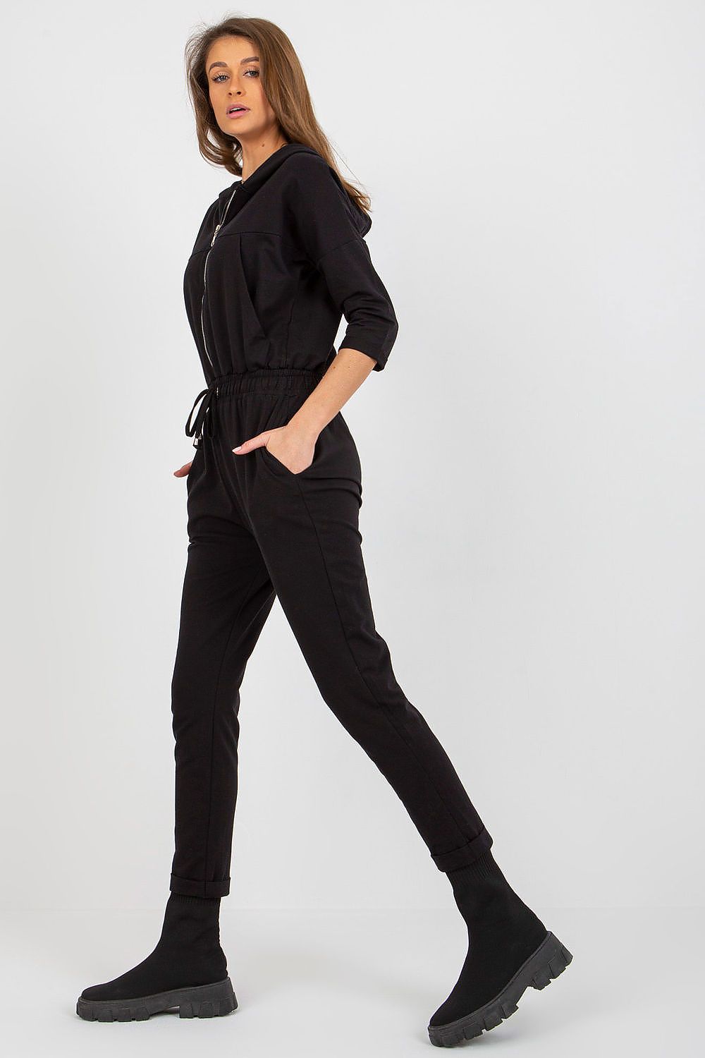 Stylish back view of Relevance's elegant women's jumpsuit with hood, highlighting the chic design and functionality perfect for modern women.