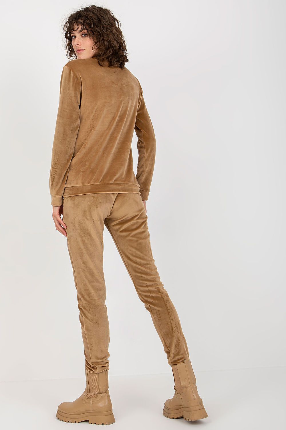 Back view of luxury velour blouse and pants set by Relevance, showcasing soft fabric and sophisticated style in a chic brown hue.