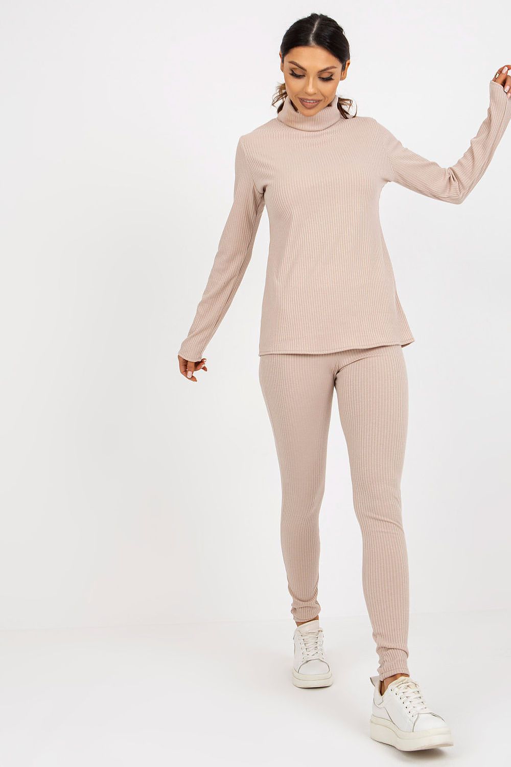 Elegant women's turtleneck blouse from Lakerta, showcased in a dynamic walking pose, illustrating its stylish ribbed design and versatile appeal.
