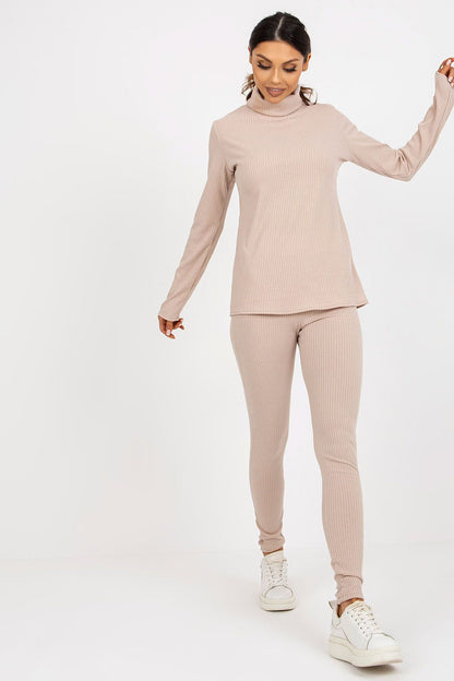 Elegant women's turtleneck blouse from Lakerta, showcased in a dynamic walking pose, illustrating its stylish ribbed design and versatile appeal.