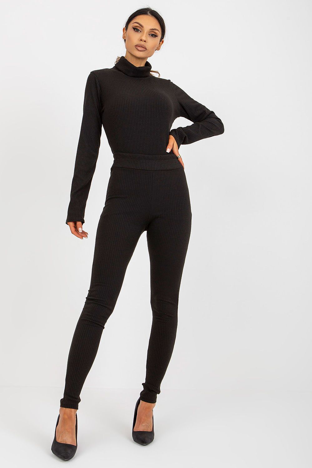 Sophisticated model showcasing Lakerta high waist striped leggings paired with a matching black turtleneck, standing confidently against a minimalist backdrop, ideal for stylish casual outings.
