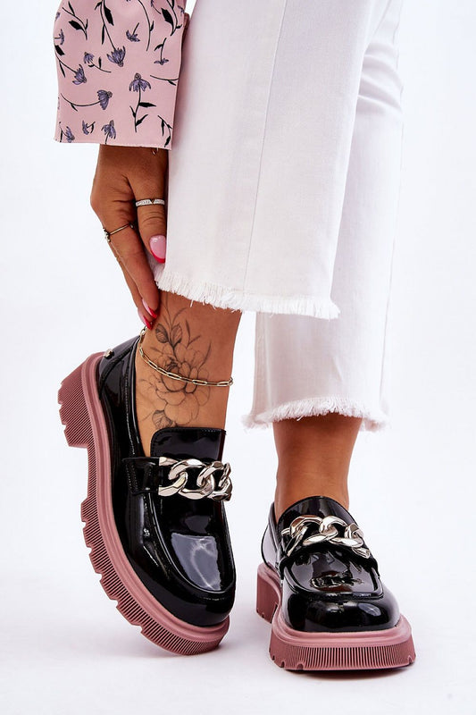 Elegant women's natural leather moccasins with chain detail and non-slip sole, designed by Step in Style, showcased in a stylish pose.