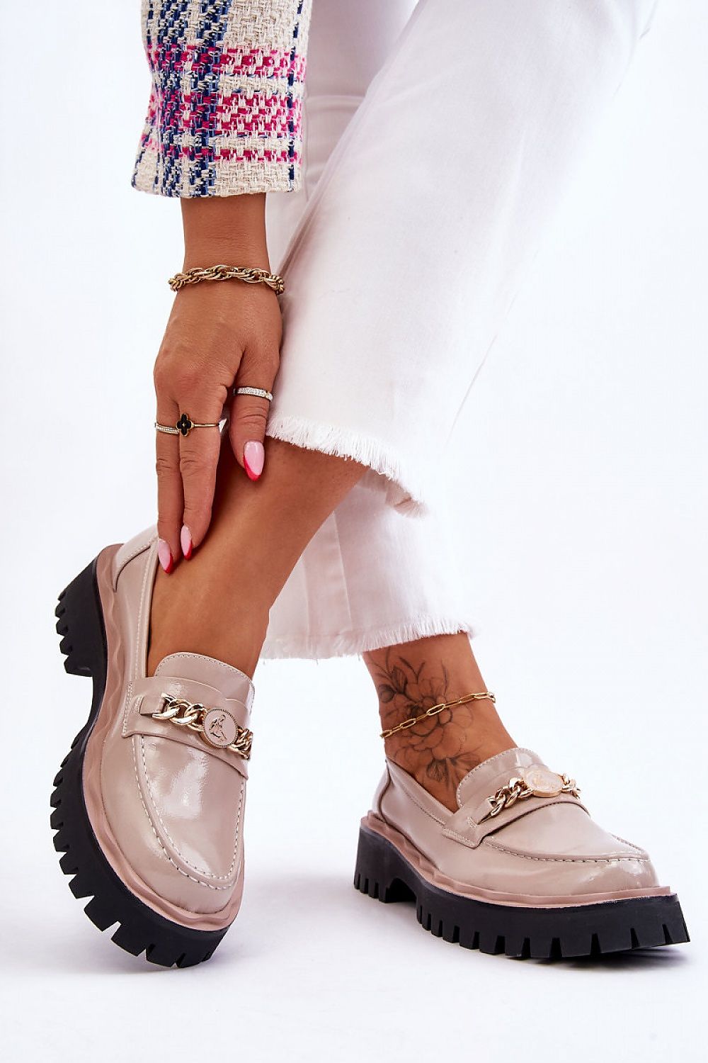 Stylish Eco Leather Moccasin Shoes featuring a decorative chain, model showcasing elegance with a chic white outfit, by Step in Style.