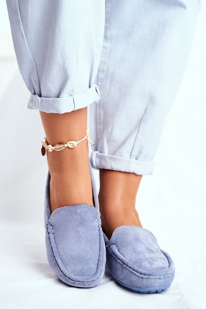 Fashionable light blue moccasins accentuated by rolled-up trousers, showcasing a comfortable and stylish design with natural leather insole by Step in Style.
