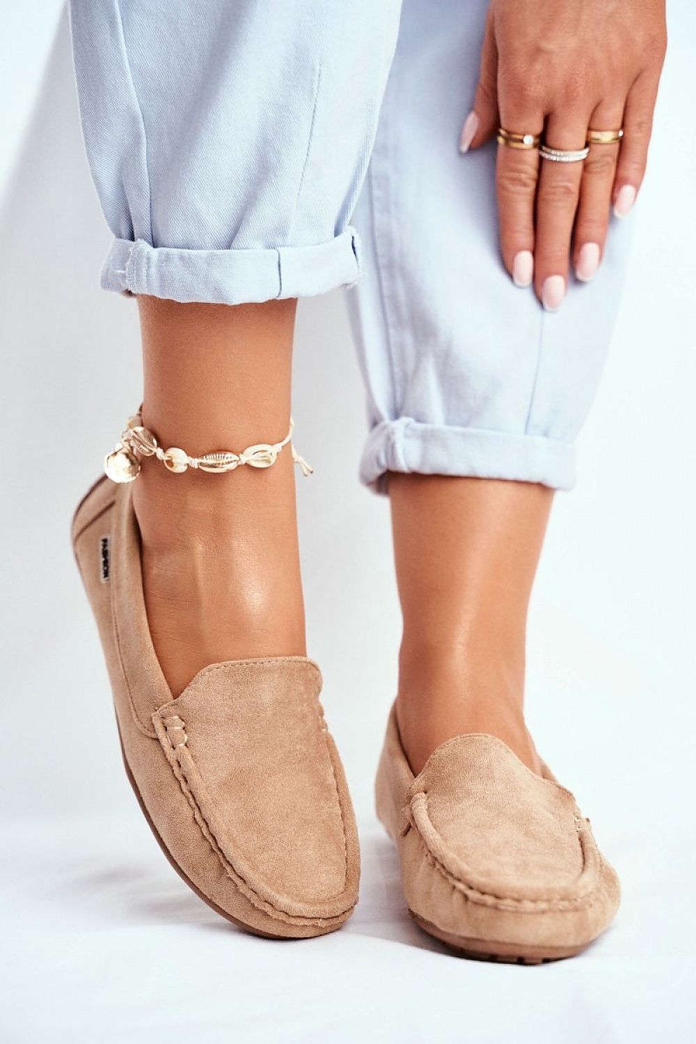 Luxurious light beige moccasins perfectly paired with casual attire, highlighting the soft suede and natural leather insole, designed for ultimate comfort by Step in Style.