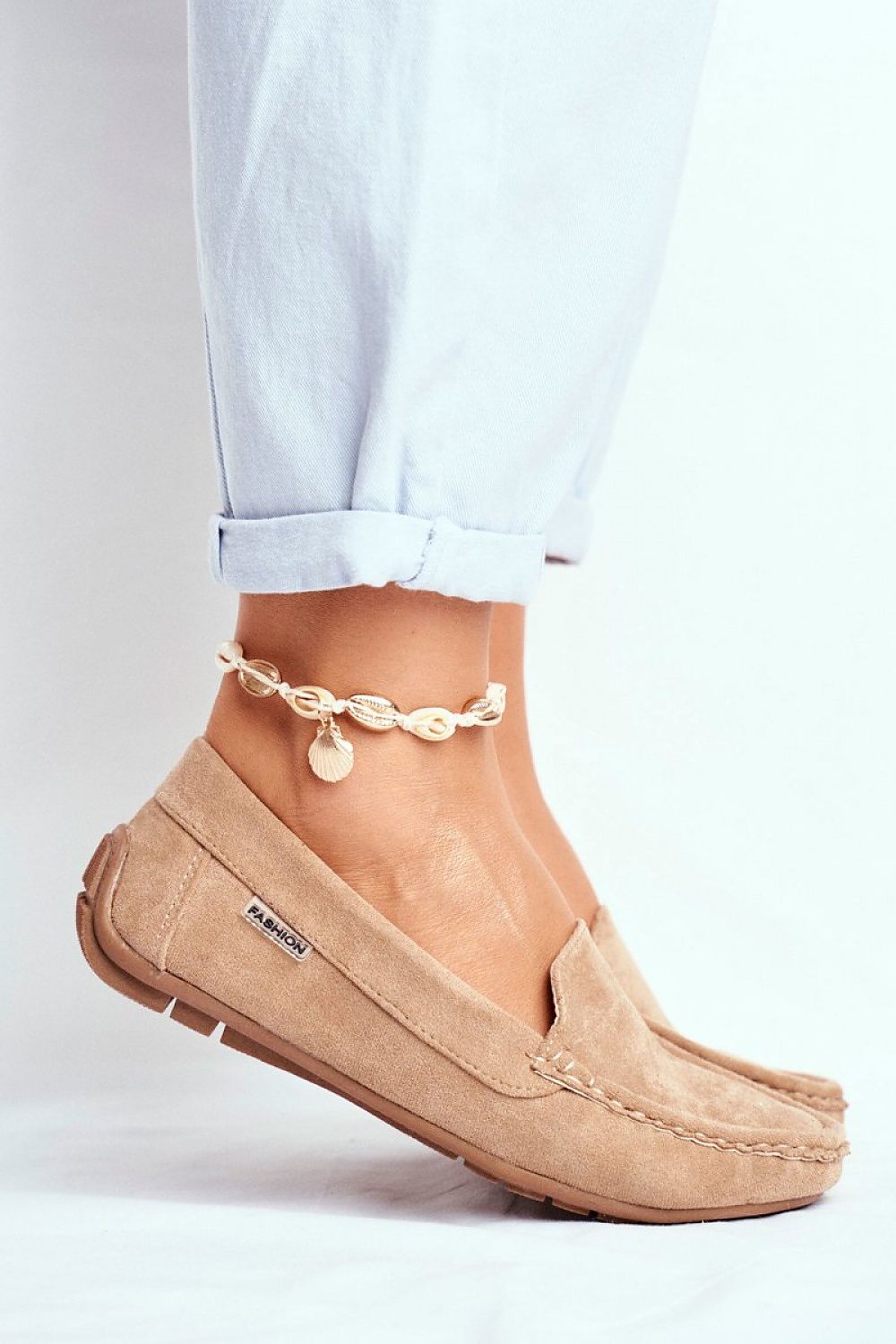 Elegant lightweight suede moccasins worn with rolled-up jeans, featuring a natural leather insole, by Step in Style, perfect for everyday luxury.