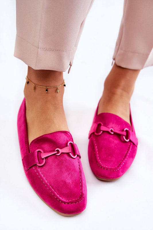 Luxury Eco Suede Moccasins in vibrant pink showcased on a model, paired elegantly with tailored trousers, emphasizing the non-slip sole and decorative accent by Step in Style.