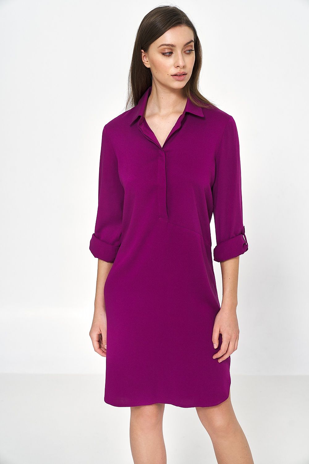 Elegant woman showcasing the Nife oversized viscose daydress in a rich purple hue, perfect for transitioning from office to casual looks.