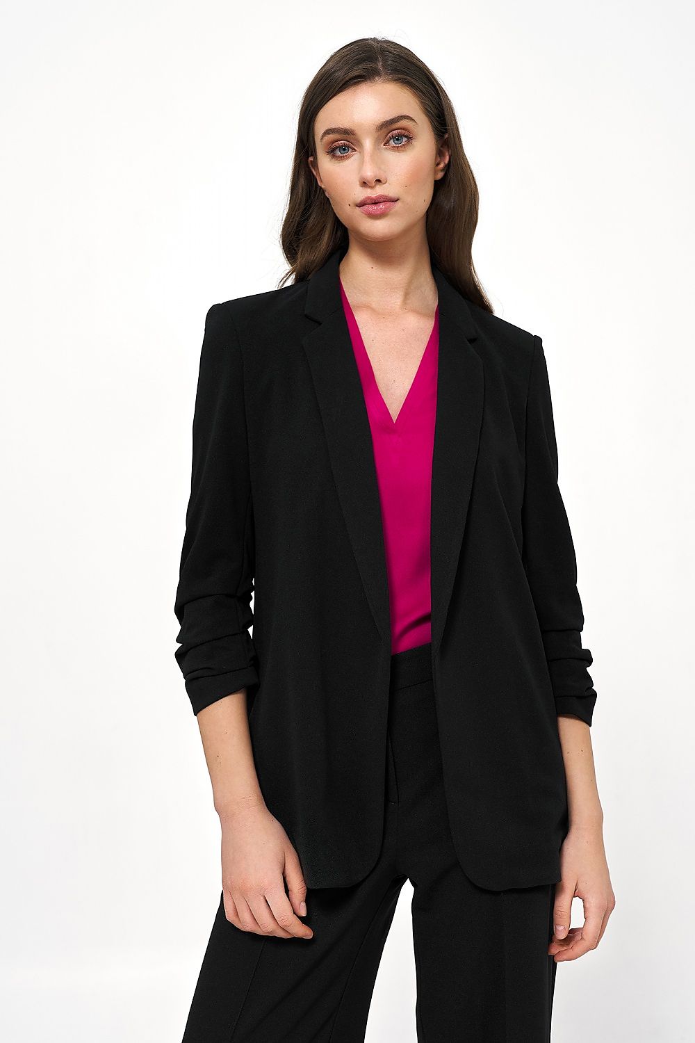Elegant black Nife jacket for women, showcasing a stylish fit with creased sleeves, paired with a vibrant pink top, perfect for casual and formal office settings.
