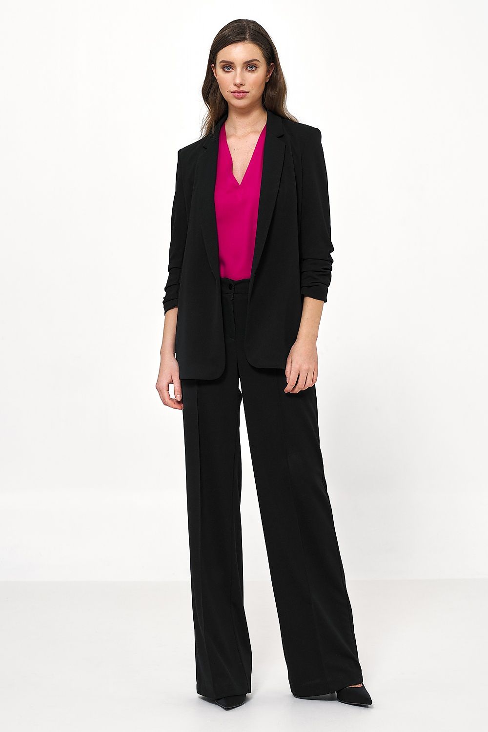 Sophisticated women's Nife jacket in black, worn with a chic pink blouse, exuding an aura of luxury ideal for office and casual wear.