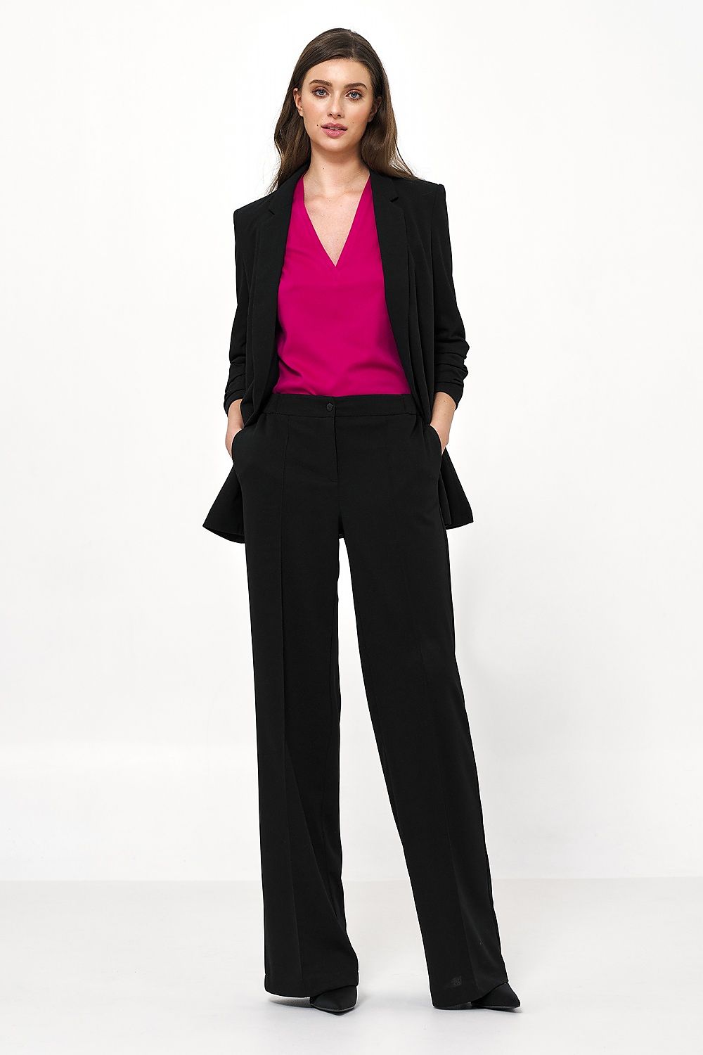 Fashion-forward Nife women's jacket in elegant black, matched with a pink top, epitomising modern office wear with a touch of sophistication.