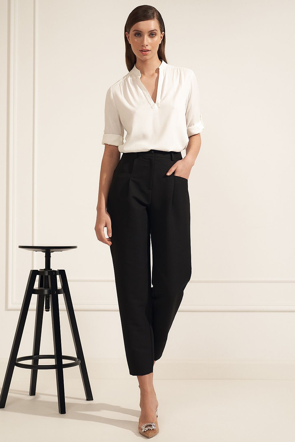 Chic Nife high-quality viscose blouse with an alluring neckline, styled effortlessly with black trousers, embodying elegance for the contemporary professional.