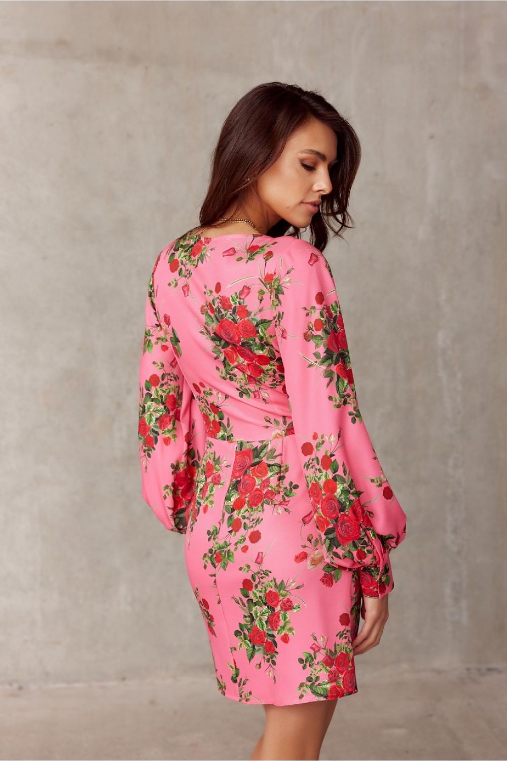 Stylish back view of the pink floral mini cocktail dress with long sleeves by Roco Fashion, designed for a sophisticated silhouette.