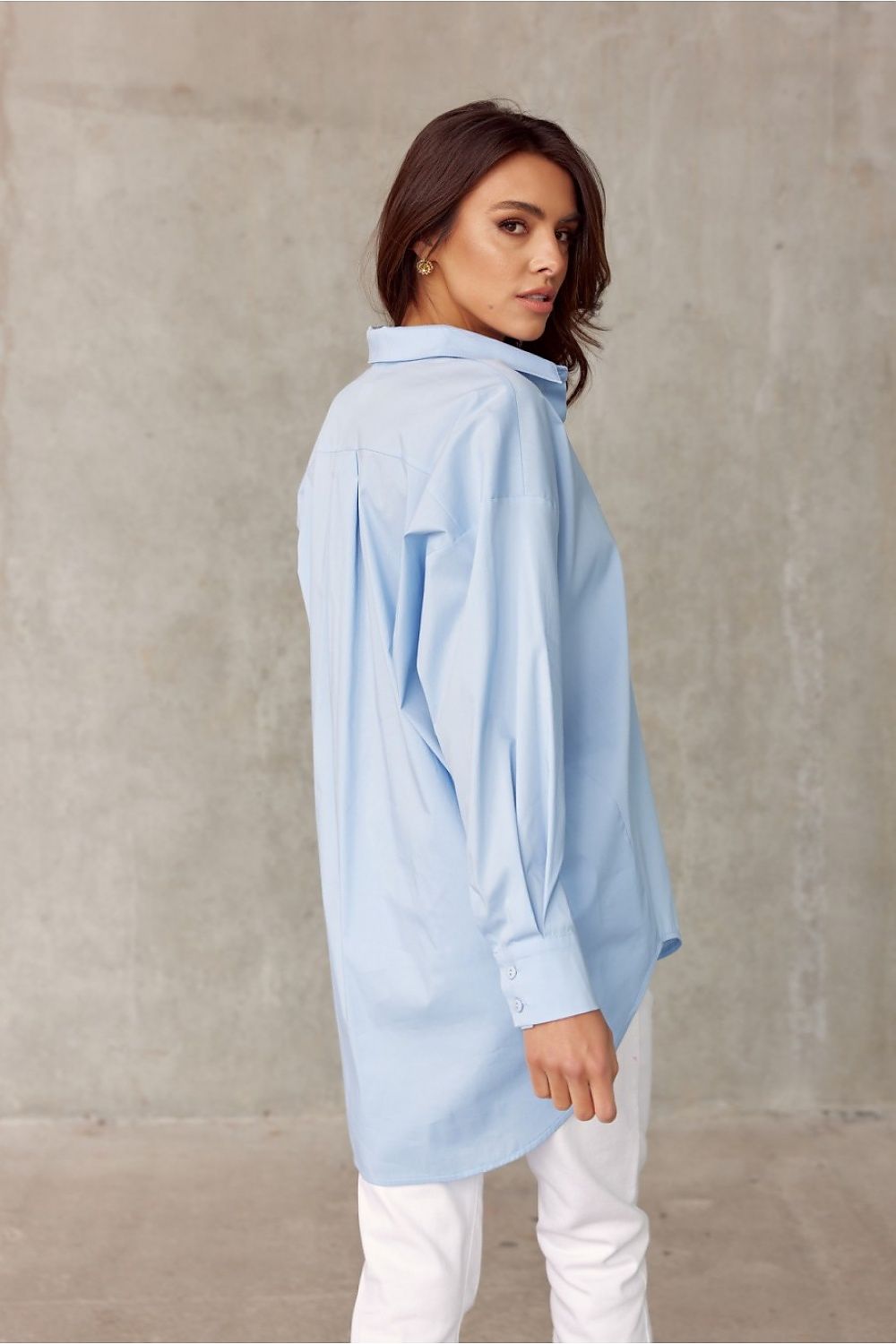 Chic back view of Roco Fashion's oversized blue long sleeve shirt, highlighting the stylish longer back design, ideal for contemporary fashion.