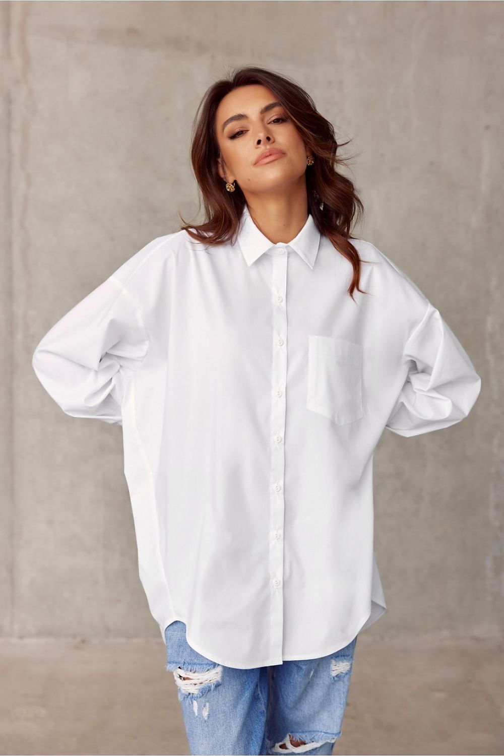 Stylish front view of white oversized long sleeve shirt by Roco Fashion, featuring a relaxed fit and elegant detailing, perfect for luxurious everyday wear.