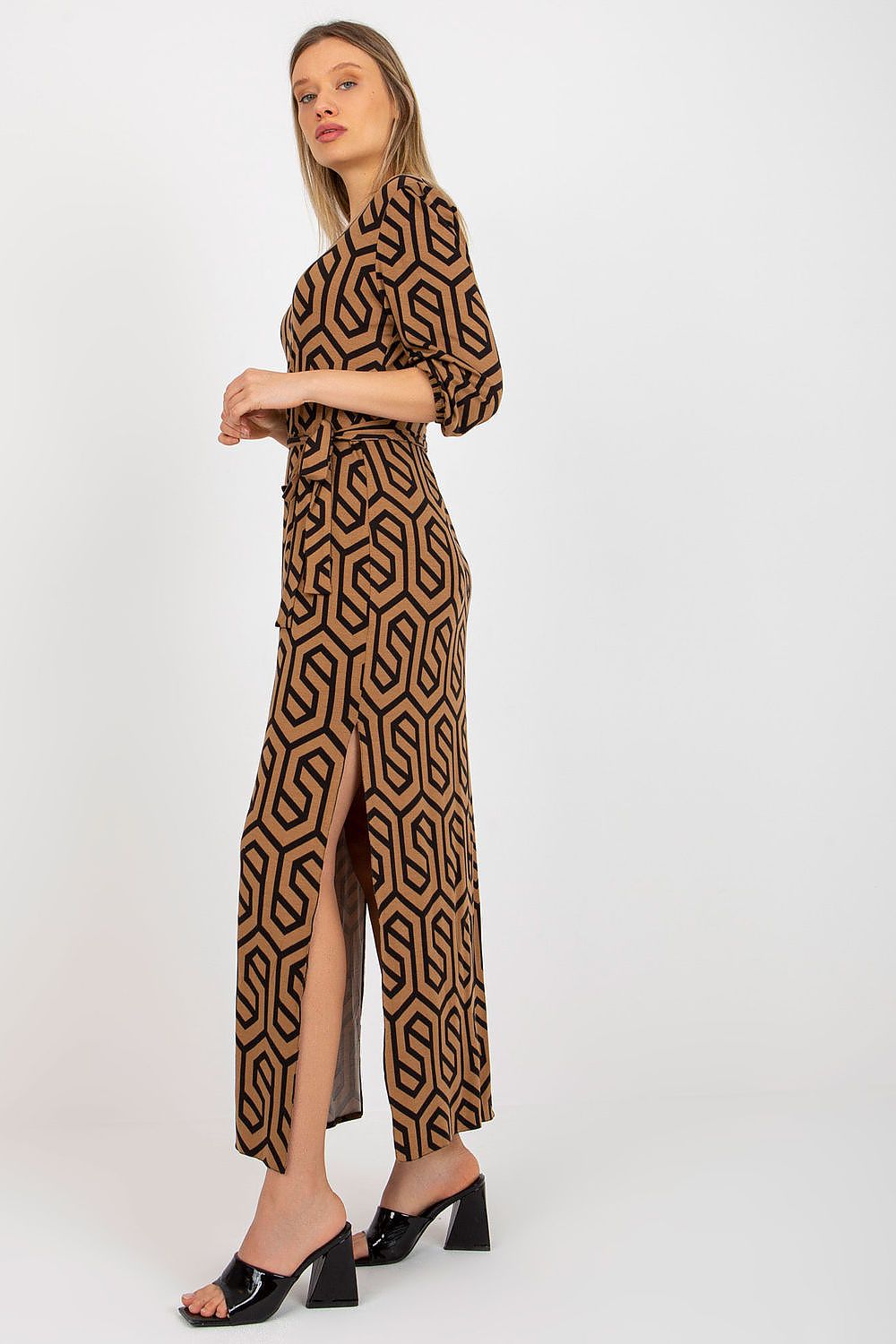 Chic side view of the Lakerta long dress with a modern geometric design, highlighting the elegant 3/4 sleeves and figure-hugging fit, perfect for upscale events.