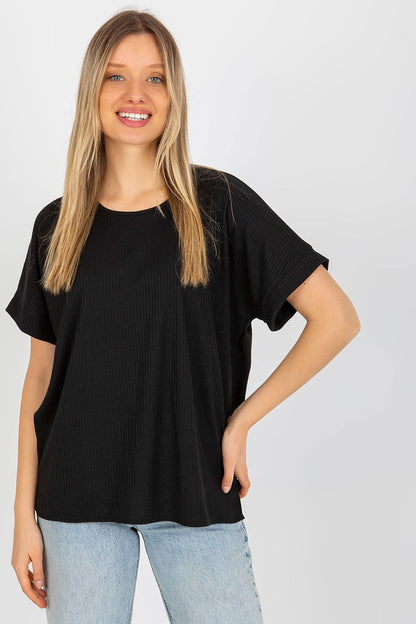 Luxury loose fit ribbed cotton blouse by Lakerta displayed on a model, featuring short sleeves and a round neckline in classic black fabric.
