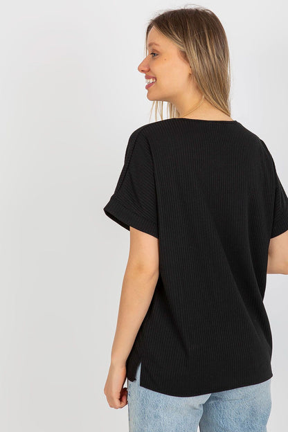 Back view of a luxury loose fit ribbed cotton blouse by Lakerta on a model, highlighting the elegant design and ribbed texture in sophisticated black.
