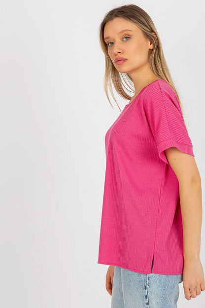 Side view of the luxury loose fit ribbed cotton blouse in pink by Lakerta, highlighting its elegant design and relaxed silhouette, ideal for a stylish everyday ensemble.
