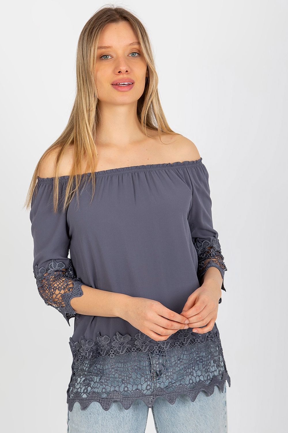 Sophisticated model showcasing the Elegant Lakerta Blouse with 3/4 sleeves and Spanish neckline, adorned with decorative lace trim, ideal for upscale casual wear.