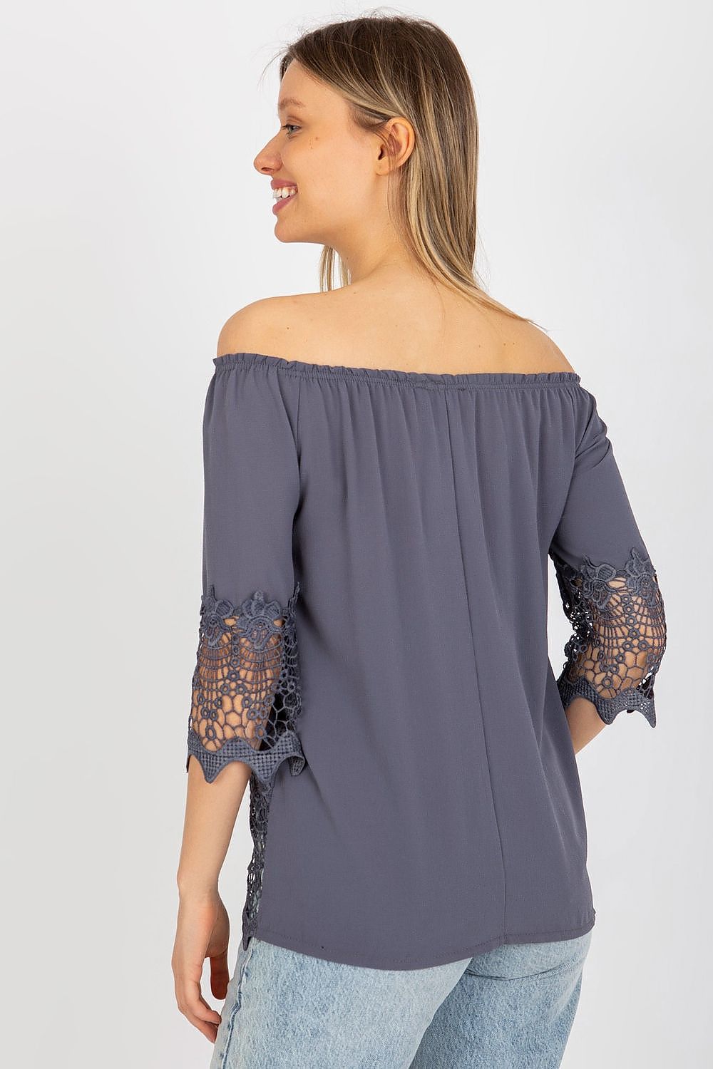 Elegant Lakerta blouse featuring intricate lace detailing at the sleeves, showcased from the back, exuding a sophisticated charm.